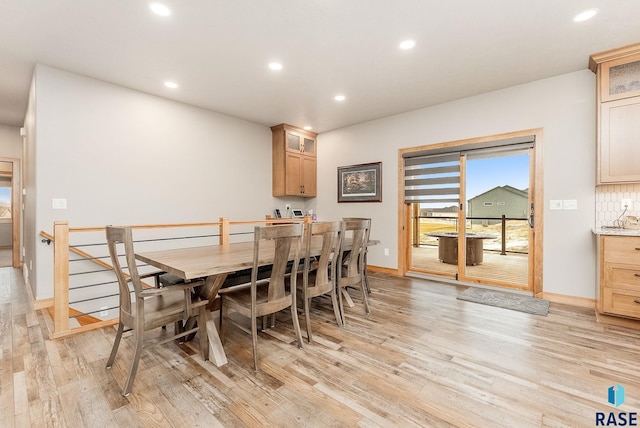 dining room with light wood-type flooring