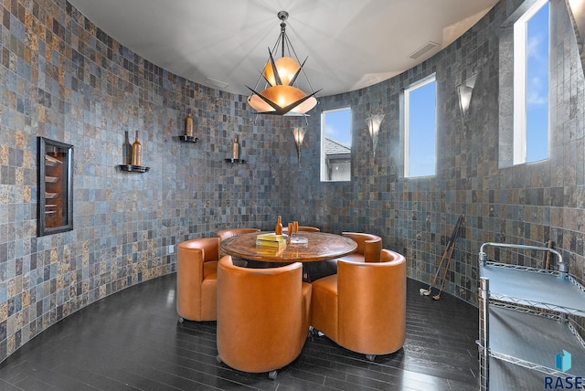 dining room with tile walls