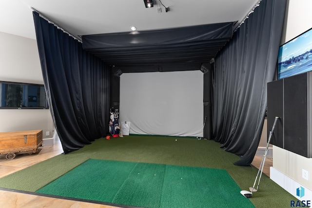 rec room with golf simulator