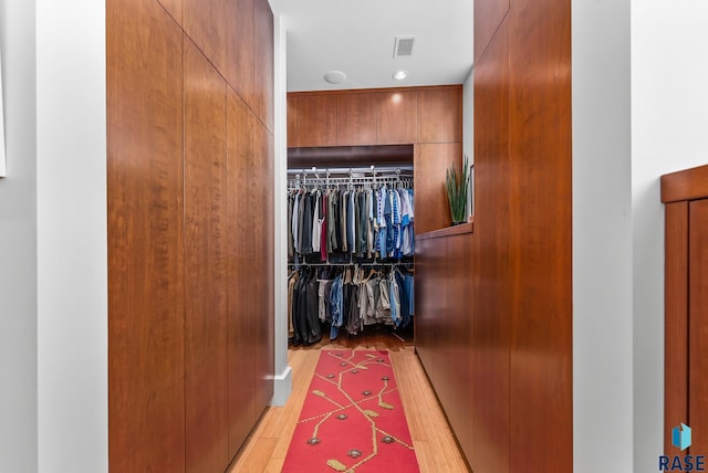 walk in closet featuring light wood-type flooring