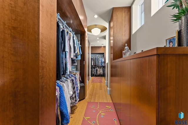 spacious closet featuring light hardwood / wood-style floors