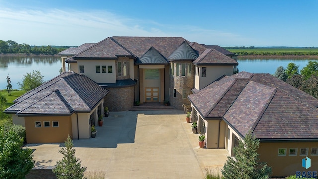 view of front of house with a water view and a garage