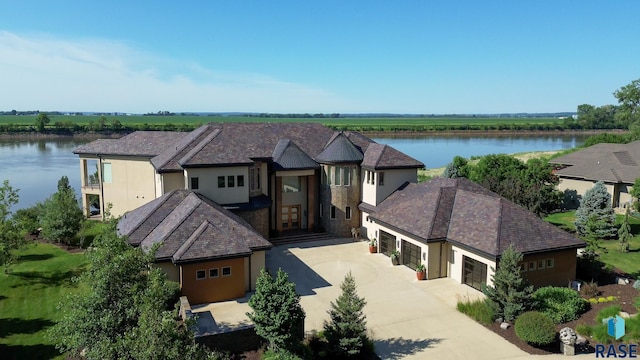 view of front facade with a water view and a garage