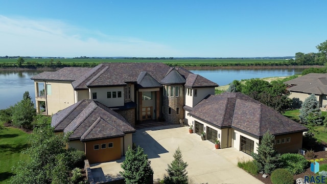 view of front of house with a water view and a garage