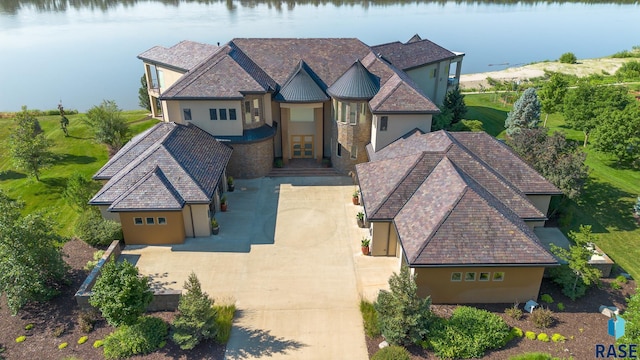 view of front of home featuring french doors and a water view