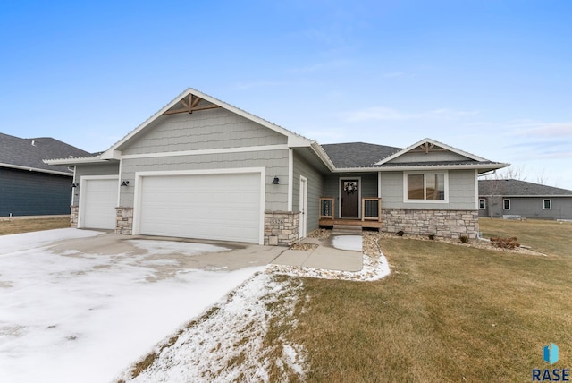 view of front of property featuring a garage and a front lawn