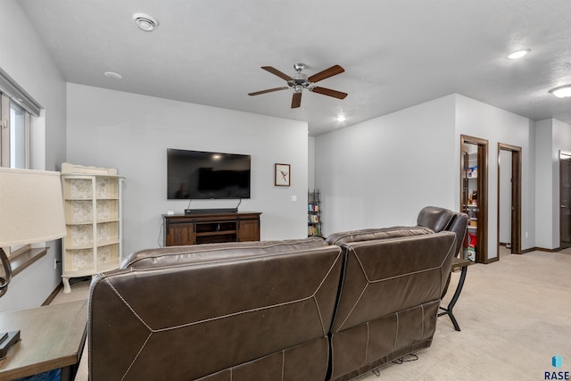 carpeted living room featuring ceiling fan