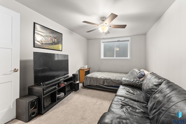 living room featuring light carpet and ceiling fan