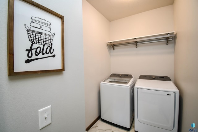 clothes washing area with washing machine and clothes dryer