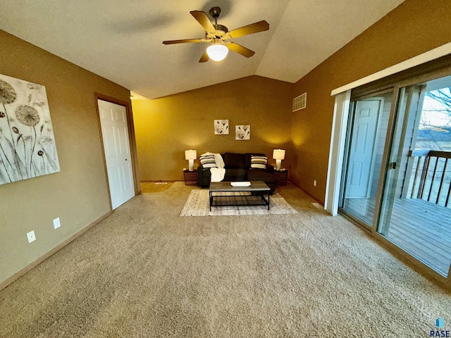 interior space featuring ceiling fan, carpet, and vaulted ceiling