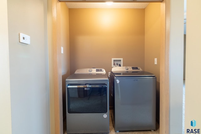 laundry room with washer and dryer