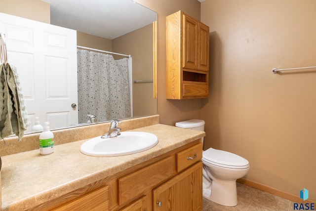 bathroom featuring tile patterned flooring, a shower with curtain, vanity, and toilet