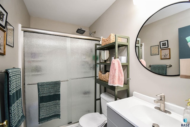 bathroom with vanity, toilet, and walk in shower