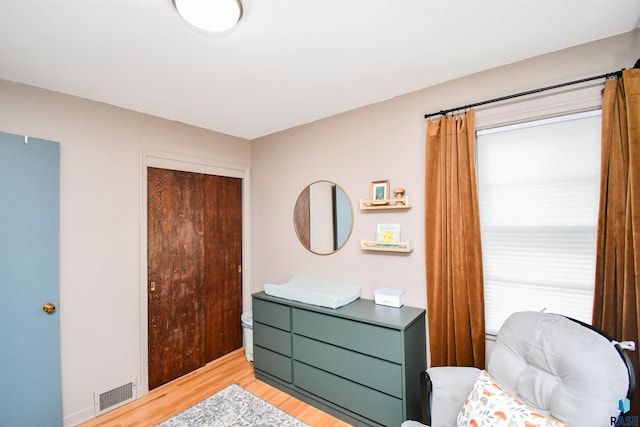 bedroom featuring light hardwood / wood-style flooring and a closet