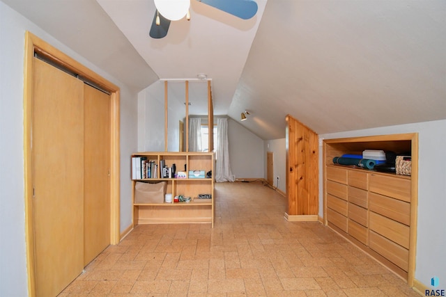 bonus room with ceiling fan and lofted ceiling