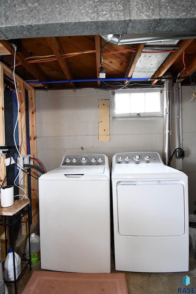 washroom with washer and dryer