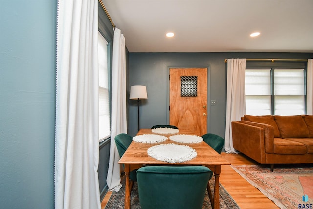 dining area with hardwood / wood-style floors and a wealth of natural light