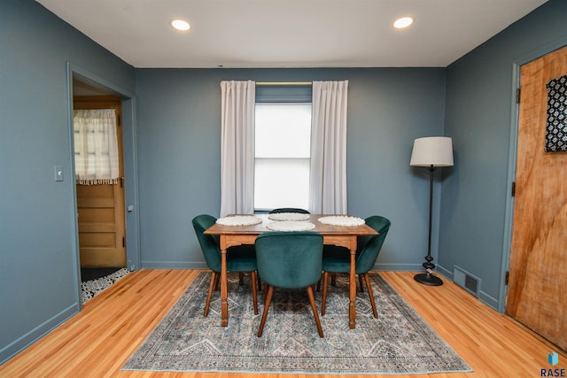 dining space featuring hardwood / wood-style flooring