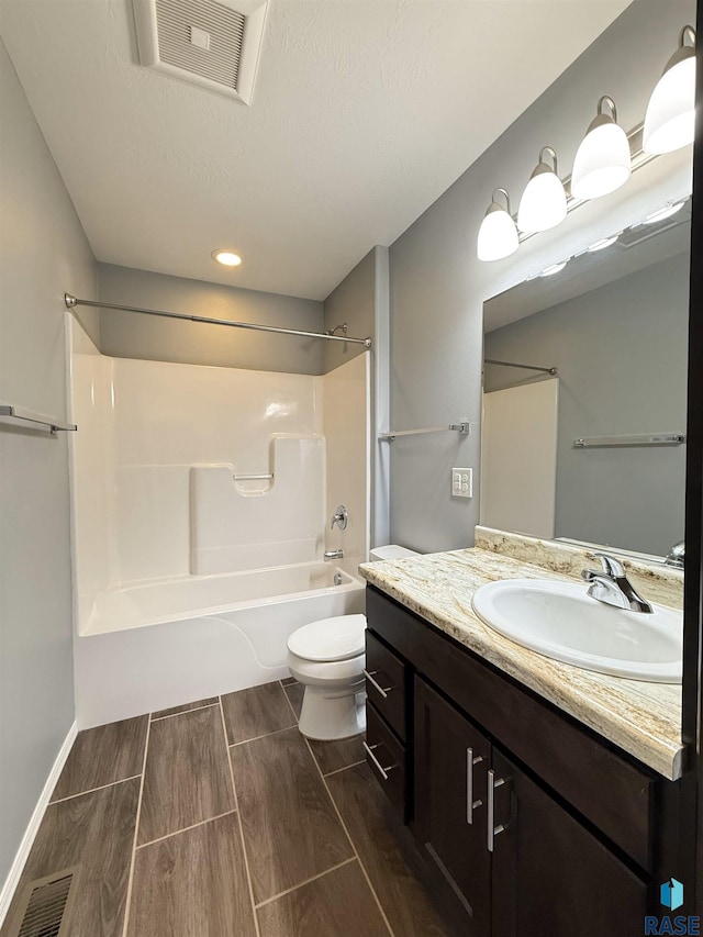 full bathroom featuring toilet, shower / washtub combination, and vanity