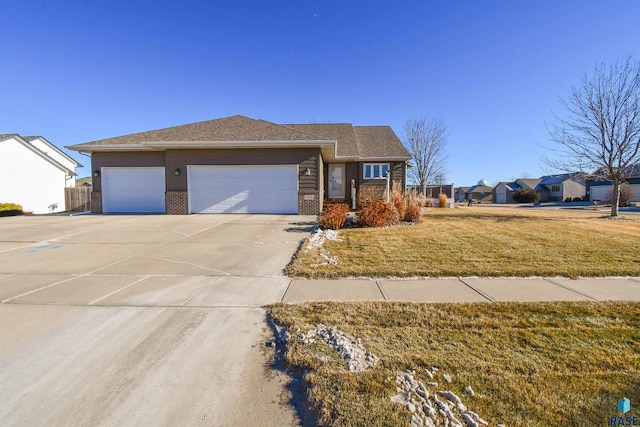 view of front facade featuring a garage and a front lawn