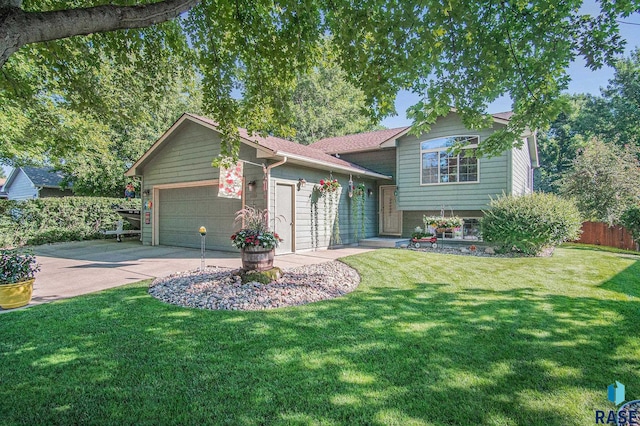 view of front facade with a garage and a front lawn