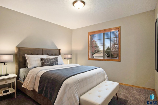 bedroom featuring dark carpet