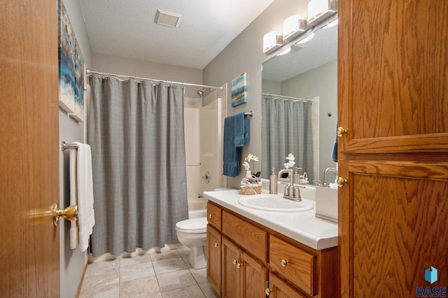 full bathroom with vanity, a textured ceiling, shower / tub combo with curtain, tile patterned flooring, and toilet