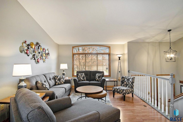 living room featuring light hardwood / wood-style flooring and a chandelier