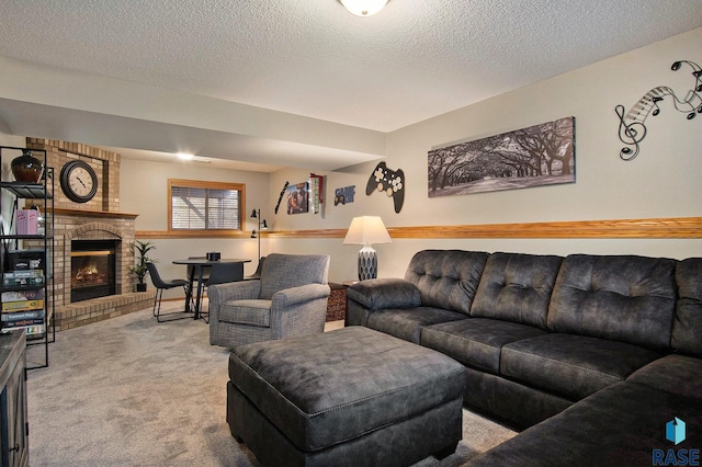 living room with a textured ceiling, carpet floors, and a fireplace