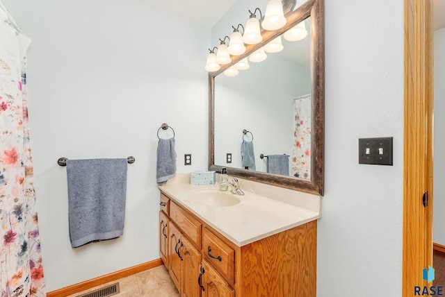 bathroom with tile patterned floors and vanity