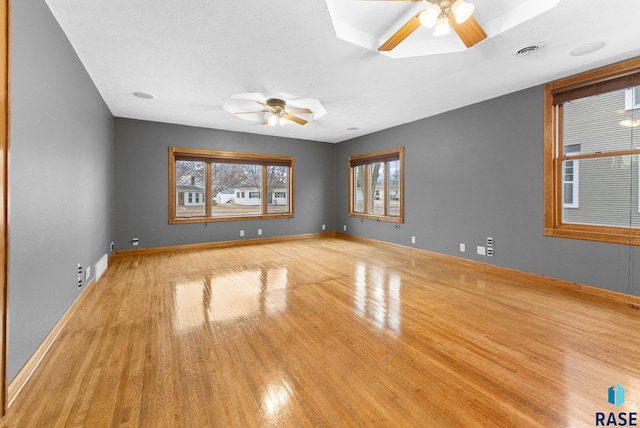 spare room with ceiling fan and light hardwood / wood-style floors