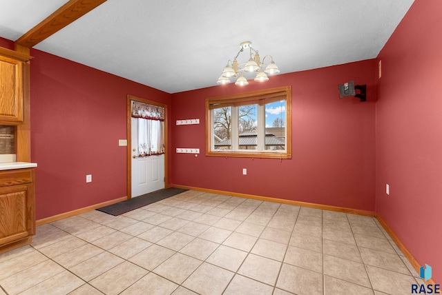 unfurnished dining area featuring beam ceiling, light tile patterned floors, and a chandelier