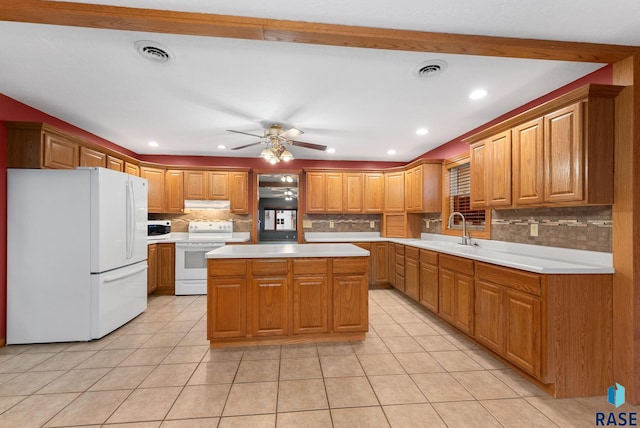 kitchen featuring ceiling fan, a center island, sink, tasteful backsplash, and white appliances