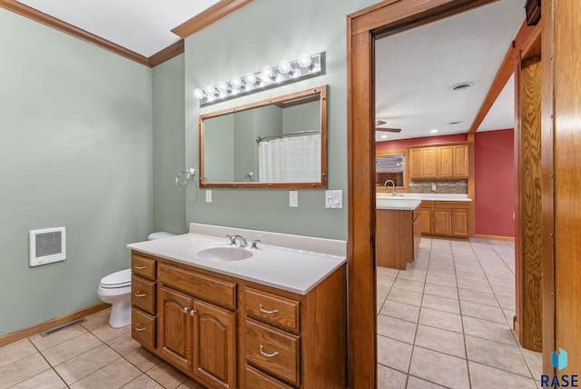 bathroom with backsplash, tile patterned floors, ceiling fan, toilet, and ornamental molding