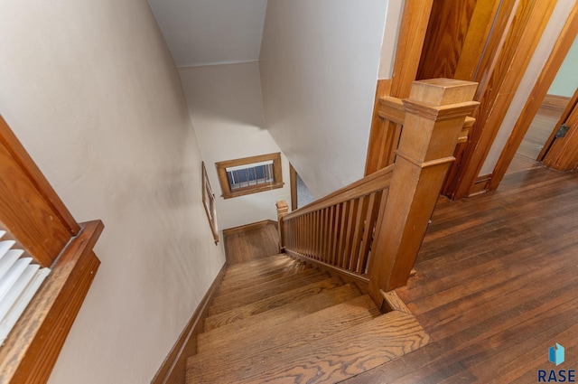 stairs with wood-type flooring