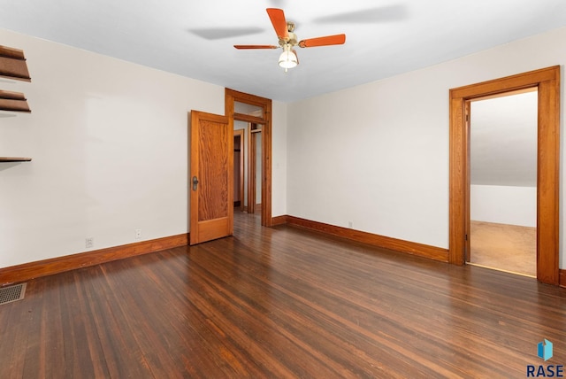 spare room featuring dark hardwood / wood-style floors and ceiling fan