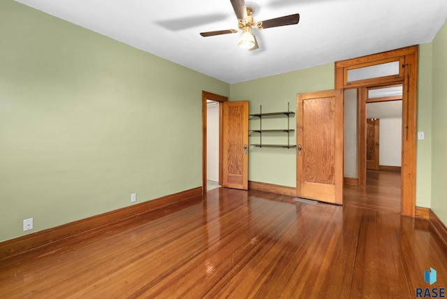 unfurnished bedroom featuring hardwood / wood-style floors and ceiling fan