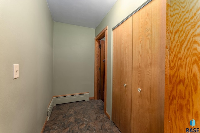 hallway with a baseboard heating unit