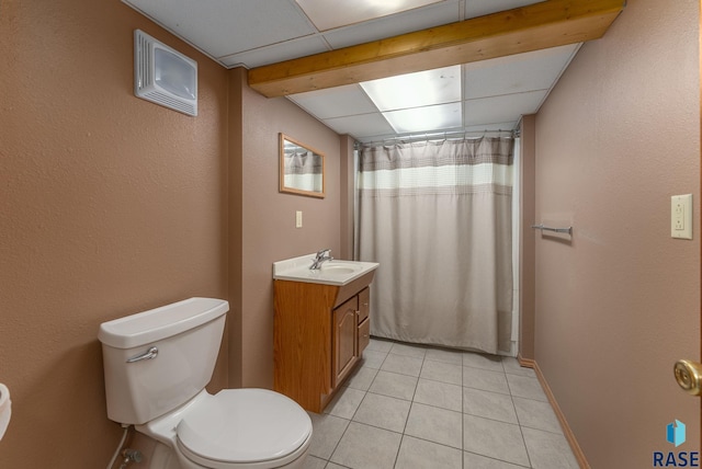 bathroom featuring tile patterned floors, curtained shower, vanity, and toilet