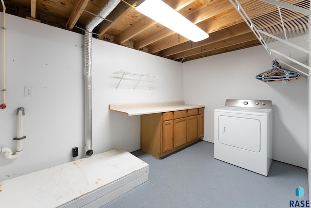 laundry area with cabinets and washer / clothes dryer