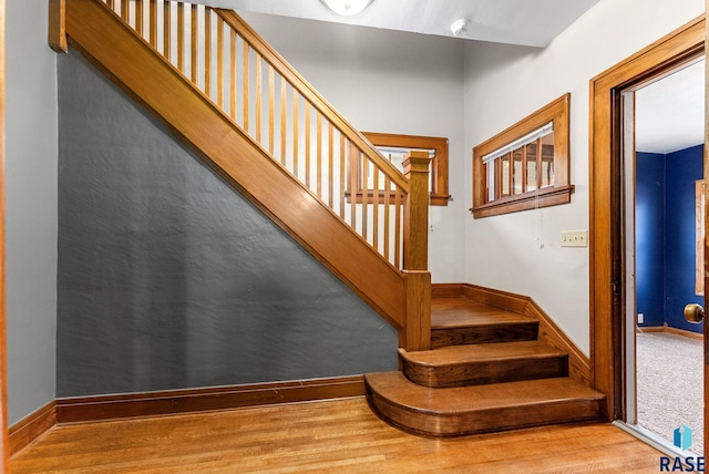 staircase featuring hardwood / wood-style flooring