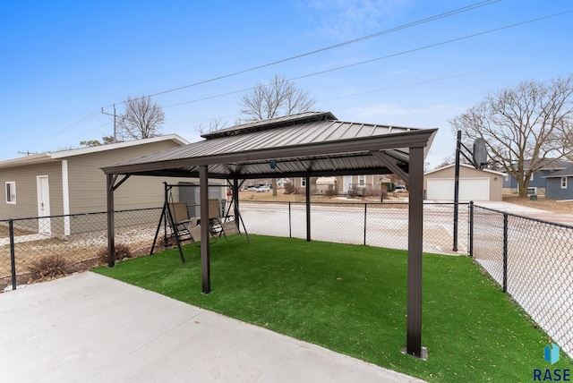 view of patio with a gazebo, a playground, and a garage