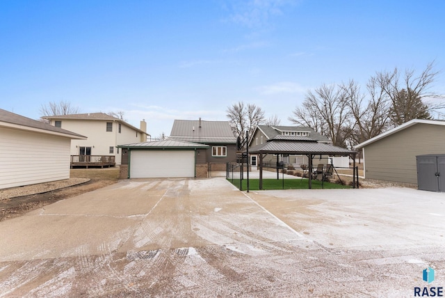 view of front of property with an outdoor structure and a garage