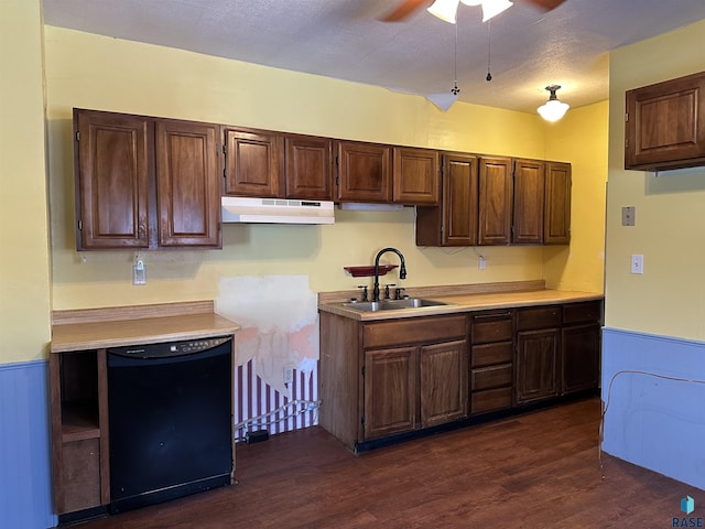 kitchen featuring ceiling fan, sink, dark wood-type flooring, black dishwasher, and a textured ceiling