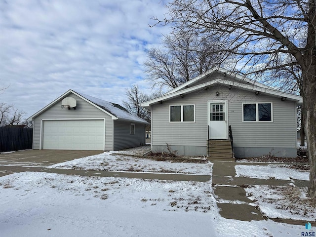 view of front of home featuring an outdoor structure and a garage