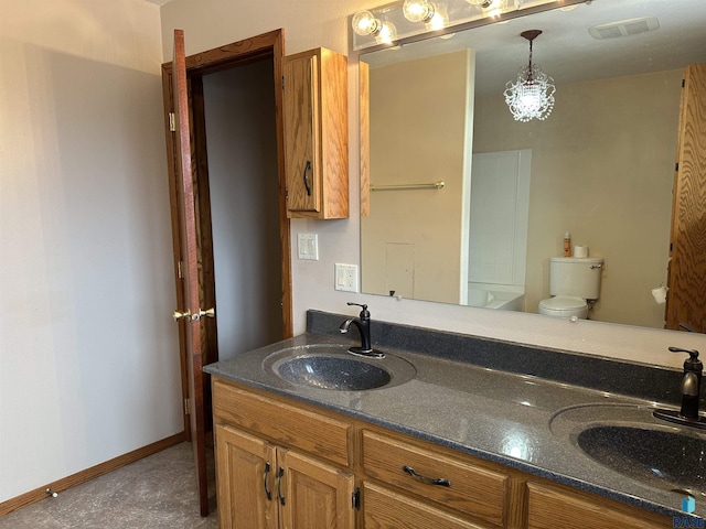 bathroom with vanity and toilet