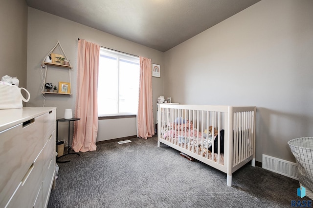 carpeted bedroom featuring a crib