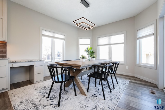 dining area featuring hardwood / wood-style flooring