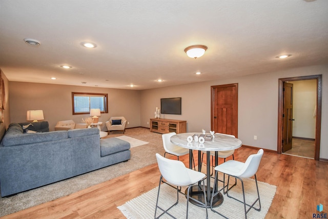 dining area with light hardwood / wood-style floors