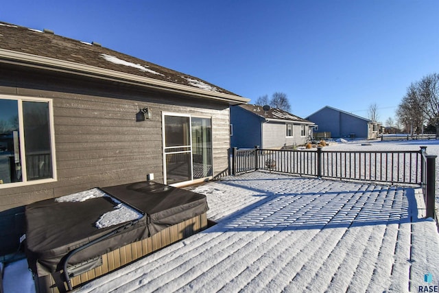 wooden deck featuring a covered hot tub